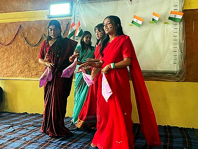 Students in saris performing a scene